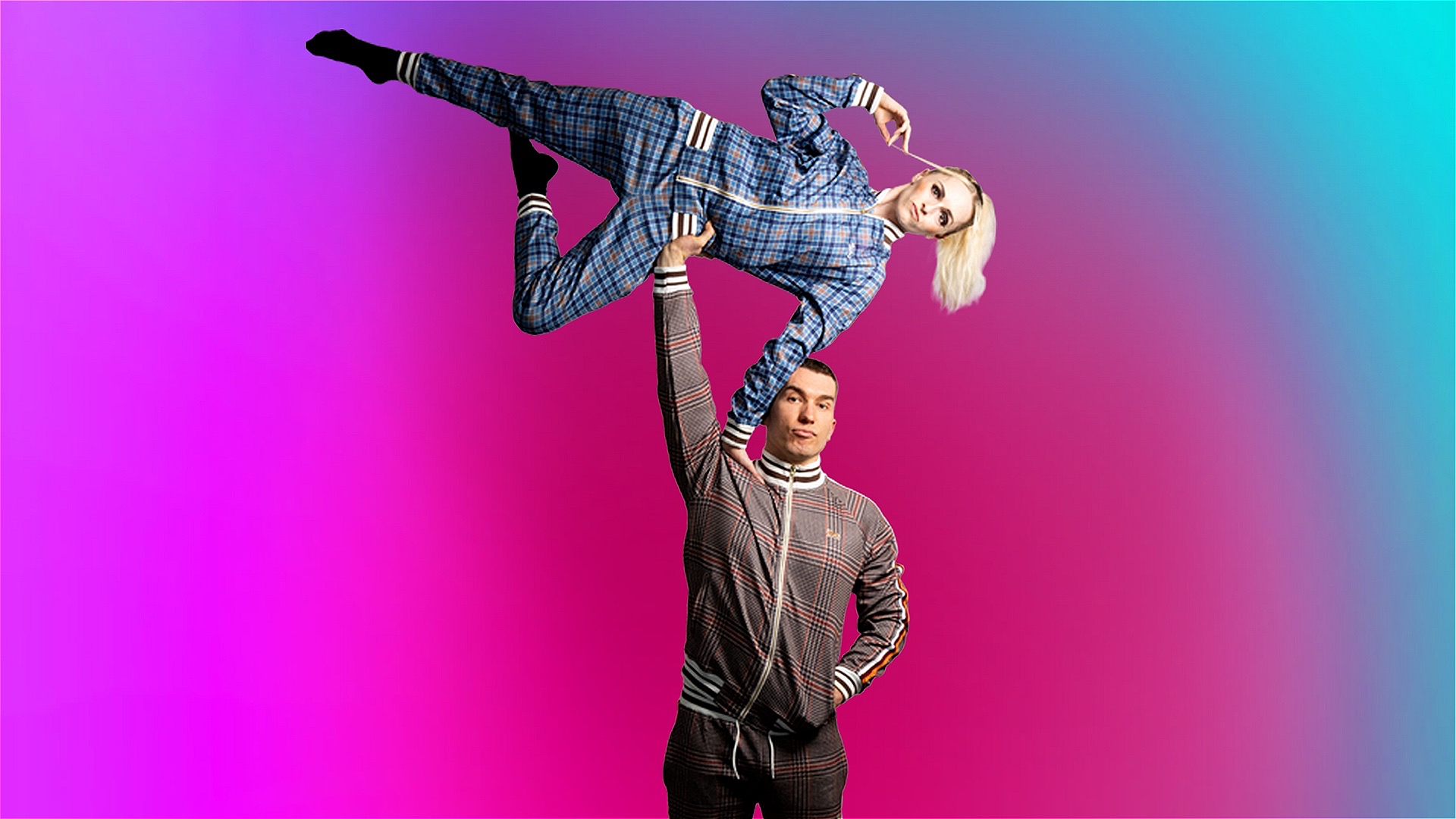 One man stands legs akimbo, arms open, he stares into the darkness. Above him a woman is suspended in the air. Separately they are just 2 people in funny positions, together they are circus.