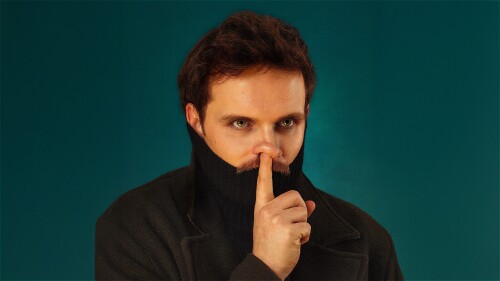 Vittorio Angelone, a moustached man, with his finger up his nose