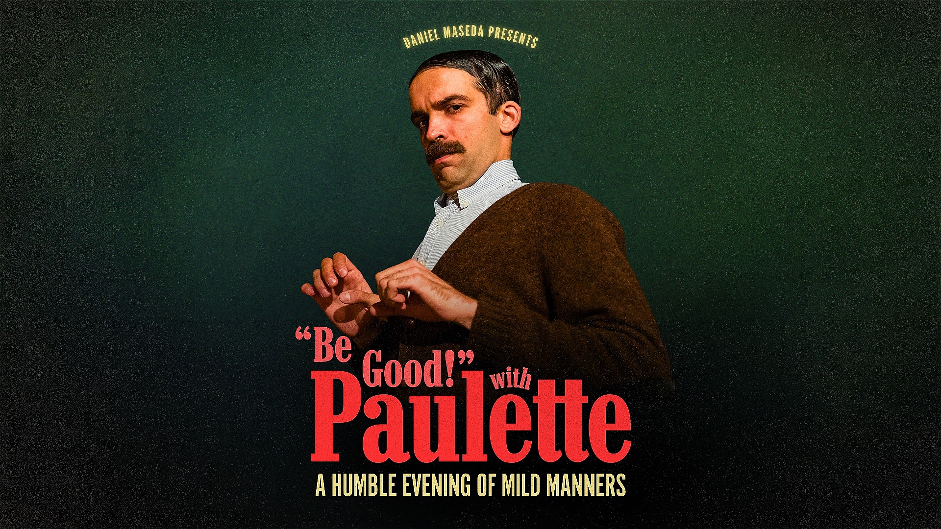 A peculiar gentleman with a big mustache and slicked down, parted hair stands cautiously against a dark green background.