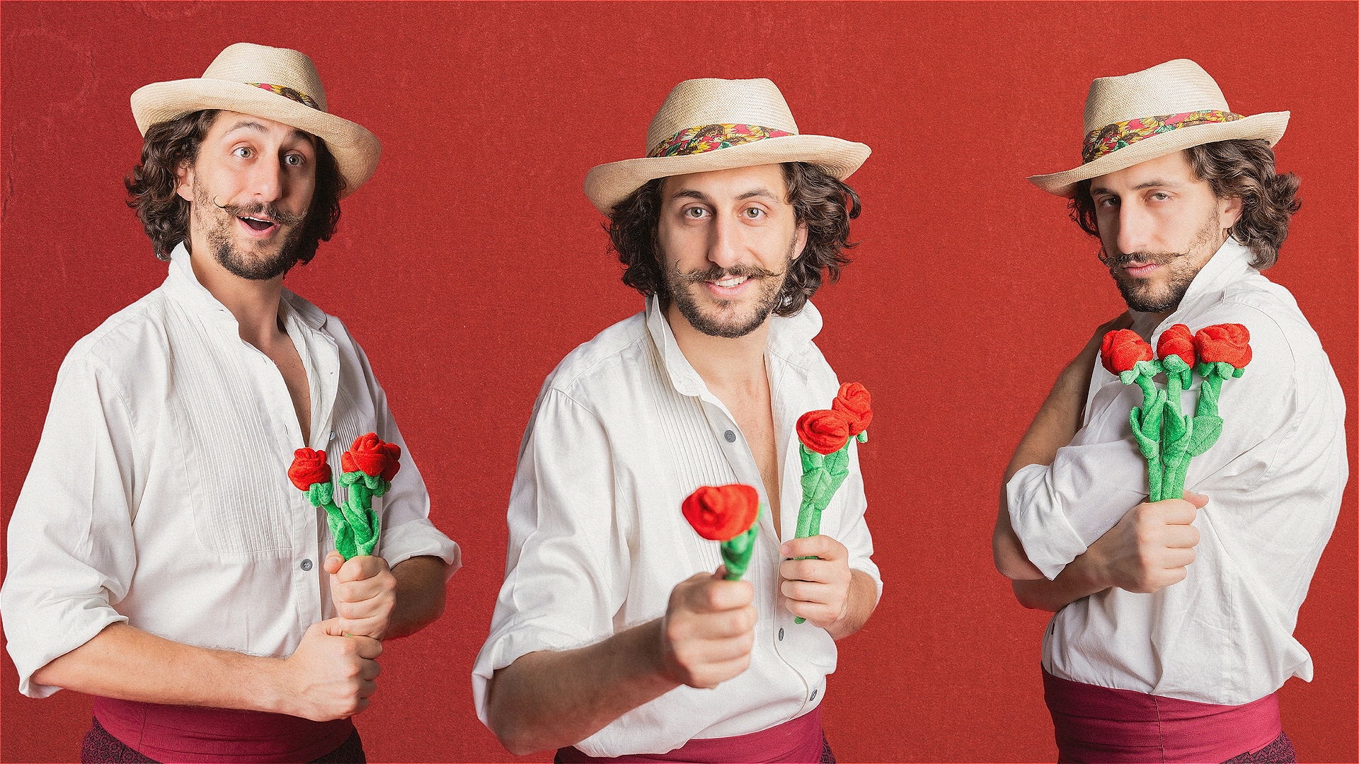 A smiling Italian man in a flowy white shirt holds a bunch of red roses and is wearing a straw hat.