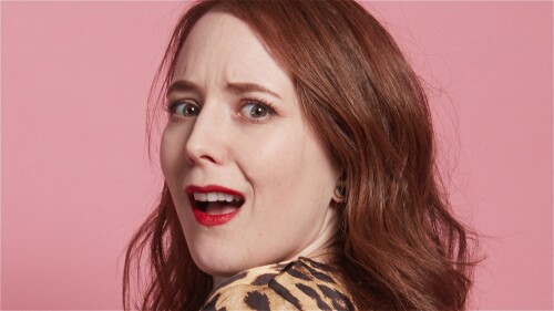 Beautiful ginger woman looking over her shoulder, shocked