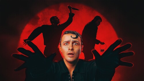 A man holds his hands outstretches as two sillhouettes, one of a man with a knife and one of a man with a ring of keys, lurk behind him.