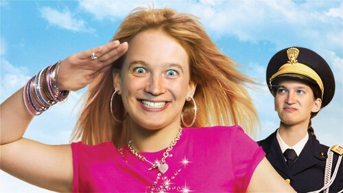 A doctored version of the original Cadet Kelly poster. In the foreground is a young girl in pink saluting, her face has been swapped with the performer's face and he's looking intensely psychotic. Another character dressed in military garb looks at her d