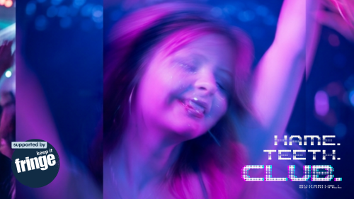 A girl dances with her eyes closed in a dark room with fairy lights. She wears glitter on her face and is smiling