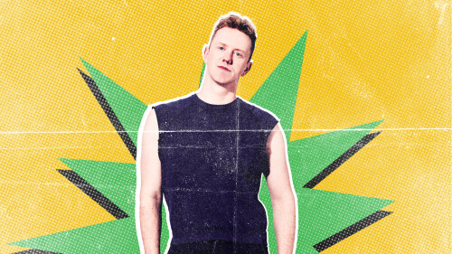 James Barr poses against a yellow background with a green cut out star 